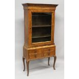 AN 18TH CENTURY WALNUT GLASS FRONTED CUPBOARD on a later stand, with two candle slides and four