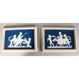 A GOOD PAIR OF FRAMED BLUE AND WHITE PATE SUR PATE PLAQUES, signed, Possibly MINTON, cupid with a
