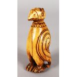 AN EARLY IVORY CARVING OF A PENGUIN, standing upright, the detachable head forms a stopper. 9cms