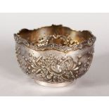 A CONTINENTAL CIRCULAR BOWL, 4.5ins diameter, with floral repousse decoration.
