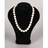 A STRING OF PEARLS with 14ct gold clasp.