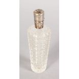 A CUT TAPERING CRYSTAL SCENT BOTTLE with silver top. 3.5ins long.