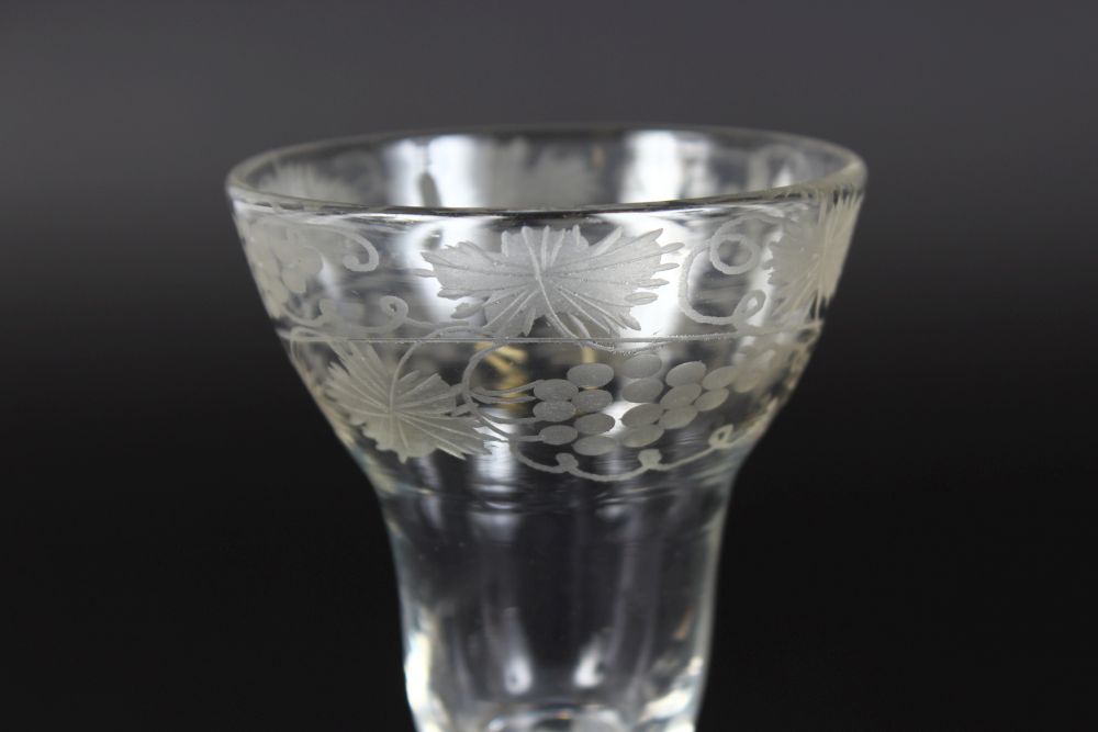 A GEORGIAN WATER GLASS with air twist stem, bowl engraved with fruiting vines. 6ins high. - Image 2 of 3