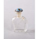 A LIBERTY OF LONDON CLEAR GLASS PERFUME BOTTLE with enamel stopper by BERNARD INSLOW. 4cms high.