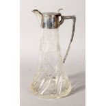 A TAPERING GLASS CLARET JUG with silver mounts and handle. 10ins high. Birmingham 1904.