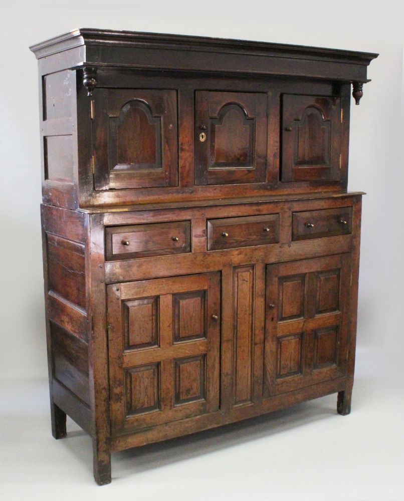 A GOOD 18TH CENTURY OAK COURT CUPBOARD of good colour, the top with three panel doors on a base with