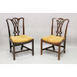 A PAIR OF CHIPPENDALE MAHOGANY SINGLE CHAIRS, with pierced splats, drop-in seats on square legs.