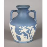 AN ADAMS VERSION OF THE PORTLAND VASE, light blue and white jasper ware. Impressed ADAMS, BROMLEY.