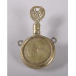 A FLAT CIRCULAR BRASS BOTTLE with brass stopper engraved "INDIA". 7cms.