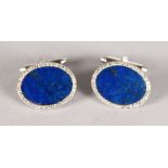 A VERY GOOD PAIR OF 18CT WHITE GOLD AND LAPIS OVAL CUFFLINKS.