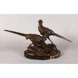 L. MAUPERTUIS (CIRCA. 1920) A BRONZE GROUP OF TWO PHEASANTS standing on a rocky base. Signed.