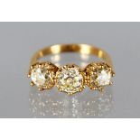 AN 18CT YELLOW GOLD THREE STONE DIAMOND RING of 3.1cts.