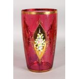 A LARGE RUBY GLASS VASE with three panels of flowers in coloured enamels. 10ins high.