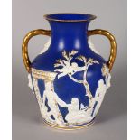 THE PORTLAND VASE, blue and white jasper ware with gilt handles and gilt on white. 11ins high.