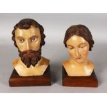 A PAIR OF 18TH-19TH CENTURY CAVED SPANISH OR ITALIAN HEAD AND SHOULDERS of a man and woman on wooden