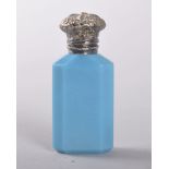 A VICTORIAN TURQUOISE OPALINE GLASS PERFUME BOTTLE and stopper with hinged silver top. 6.5cms.