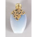 A GOLD AGATE GOLD MOUNTED SCENT BOTTLE. 8.5cms long.
