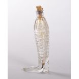 A CLEAR GLASS BOOT SHAPED SCENT BOTTLE, CIRCA. 1910. 7cms long. Provenance: SOFFE, BANBURY 1997.