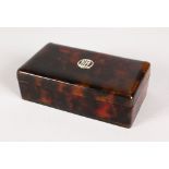 A TORTOISESHELL RING BOX, initials EB in silver. 11cms long.