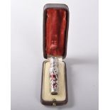 A SUPERB 19TH CENTURY FRENCH RED ENAMEL AND SILVER CASE, sculptured with lotus blossom, French