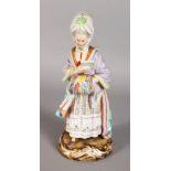 A GOOD 19TH CENTURY MEISSEN FIGURE OF A LADY, "RACEGOER'S COMPANION", carrying a book. Cross