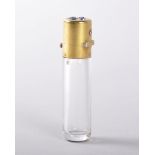 A 19TH CENTURY FRENCH CLEAR CRYSTAL CYLINDRICAL PERFUME BOTTLE with gilt hinged cap, incorporating a