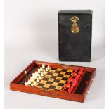 A GOOD JAQUES & SON, LONDON MAHOGANY CASED, TRAVELLING, FOLDING CHESS SET. 9ins wide, 5.5ins deep,