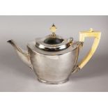 A GOOD PLAIN ART DECO SILVER TEAPOT, with ivory handle and finial. Birmingham 1905. Maker: Elkington