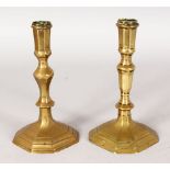 A MATCHED PAIR OF 18TH CENTURY BRASS CANDLESTICKS. 7ins high.