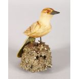 A GOOD SMALL HARDSTONE BIRD ON A ROCK. 3ins high.