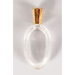 A CUT CRYSTAL GOLD MOUNTED SCENT BOTTLE. 8.5cms long.