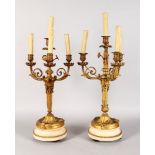 A SUPERB PAIR OF LOUIS XVI GILT ORMOLU AND WHITE MARBLE FOUR LIGHT CANDELABRA, each with three