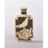 A EUROPEAN STAINED IVORY PERFUME BOTTLE decorated and carved with a bird, the reverse a stag. 4.