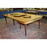 A 19TH CENTURY MAHOGANY GILLOW MODEL DINING TABLE, with three loose leaves, the support concertina