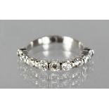 AN 18CT WHITE GOLD DIAMOND HALF ETERNITY RING of 1.2cts.