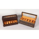 A PAIR OF MARCEL DRUCKER WATCH CASES, each holding twelve watches. 4ins high, 12ins long (2).