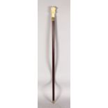 A WALKING CANE, the mahogany shaft mounted with a carved bone divers helmet handle. 3ft 1ins long.
