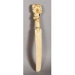 A EUROPEAN CARVED IVORY PAPER KNIFE, the handle carved as a lady with large hair bun and cap. 12.