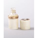 A MINIATURE 18TH CENTURY CLEAR CUT CRYSTAL PERFUME BOTTLE AND STOPPER, in an ivory case with gold
