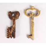 A SMALL 15TH-16TH CENTURY IRON KEY, 2.5ins long, and A POLISHED KEY, 3ins long (2).