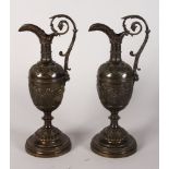 A SUPERB PAIR OF ITALIAN BRONZE CLASSICAL URNS with girls dancing, on a circular base. 12ins high.
