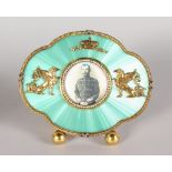 A SUPERB RUSSIAN SILVER AND ENAMEL SHAPED PHOTOGRAPH FRAME, set with seed pearls, with winged eagles