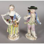 A GOOD PAIR OF MEISSEN FIGURES OF A YOUNG BOY AND GIRL, both carrying flowers, dressed in rich garb.