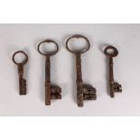 AN EARLY 17TH CENTURY IRON KEY, 5ins, and THREE OTHER KEYS, 4.5ins, 3.5ins and 3ins.