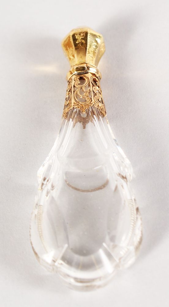 A CUT CRYSTAL GOLD MOUNTED SCENT BOTTLE. 12cms long.