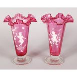 A LARGE PAIR OF MARY GREGORY PINK TRUMPET VASES, decorated in white with children playing. 11ins