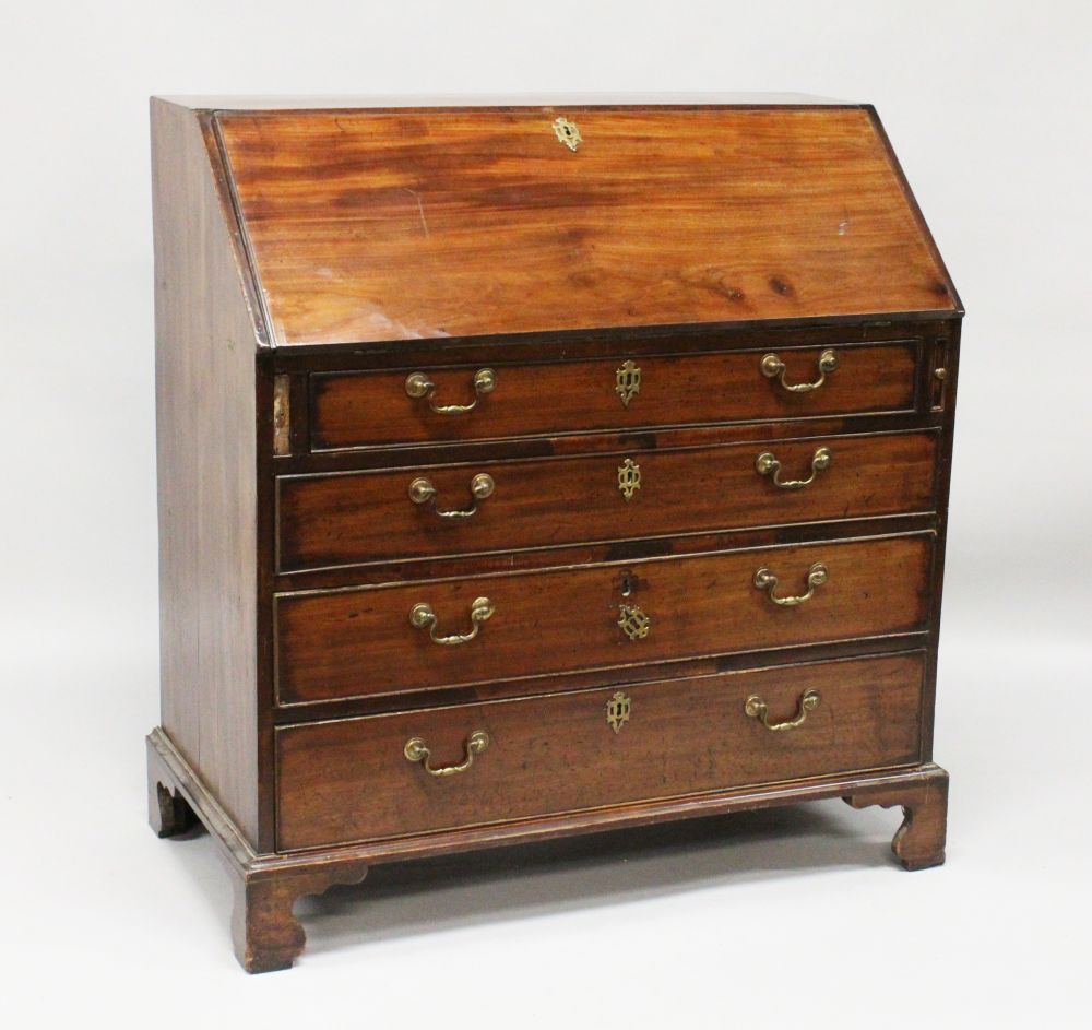 A GEORGE III MAHOGANY BUREAU, with fall front, fitted interior over four long graduated drawers with