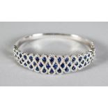 AN 18CT WHITE GOLD, SAPPHIRE AND DIAMOND BANGLE of 2.8cts approx.