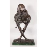 AN UNUSUAL ABSTRACT BRONZE FEMALE TORSO, with arms acting as supports, on a marble base. 2ft 5ins