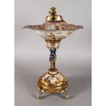 A SUPERB VIENNA ENAMEL DECORATED SILVER GILT TAZZA, the shell shaped bowl surmounted with a